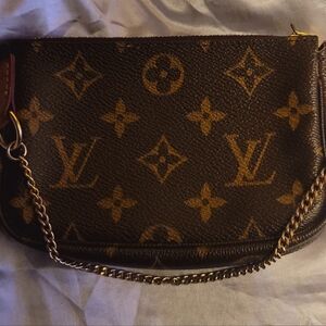 Authentic Louis Vuitton Monogram Mini Pouch - Orange